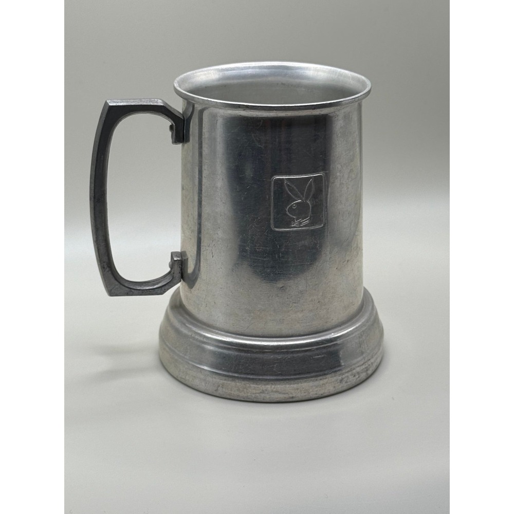 Playboy Club beer mug 1970s. It is made of aluminum and clear glass bottom
